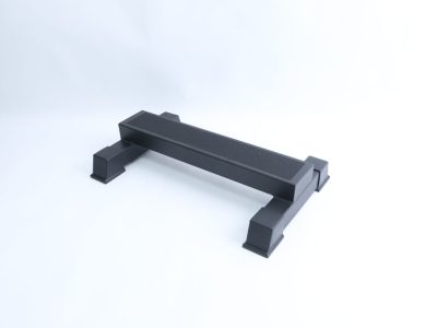 Low black steel calf raise stand with a flat platform